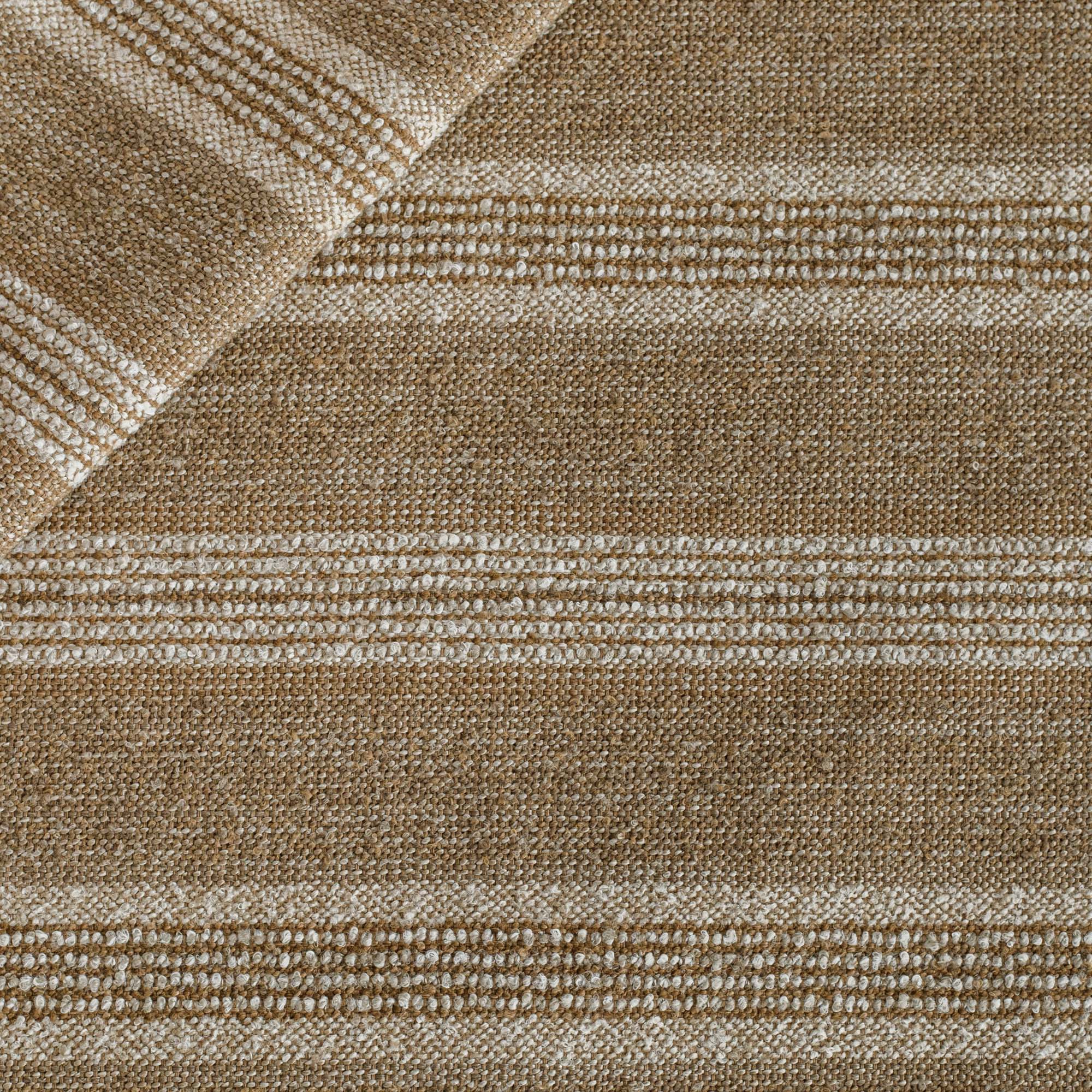 A light brown, oatmeal and white high-performance upholstery fabric from Tonic Living.