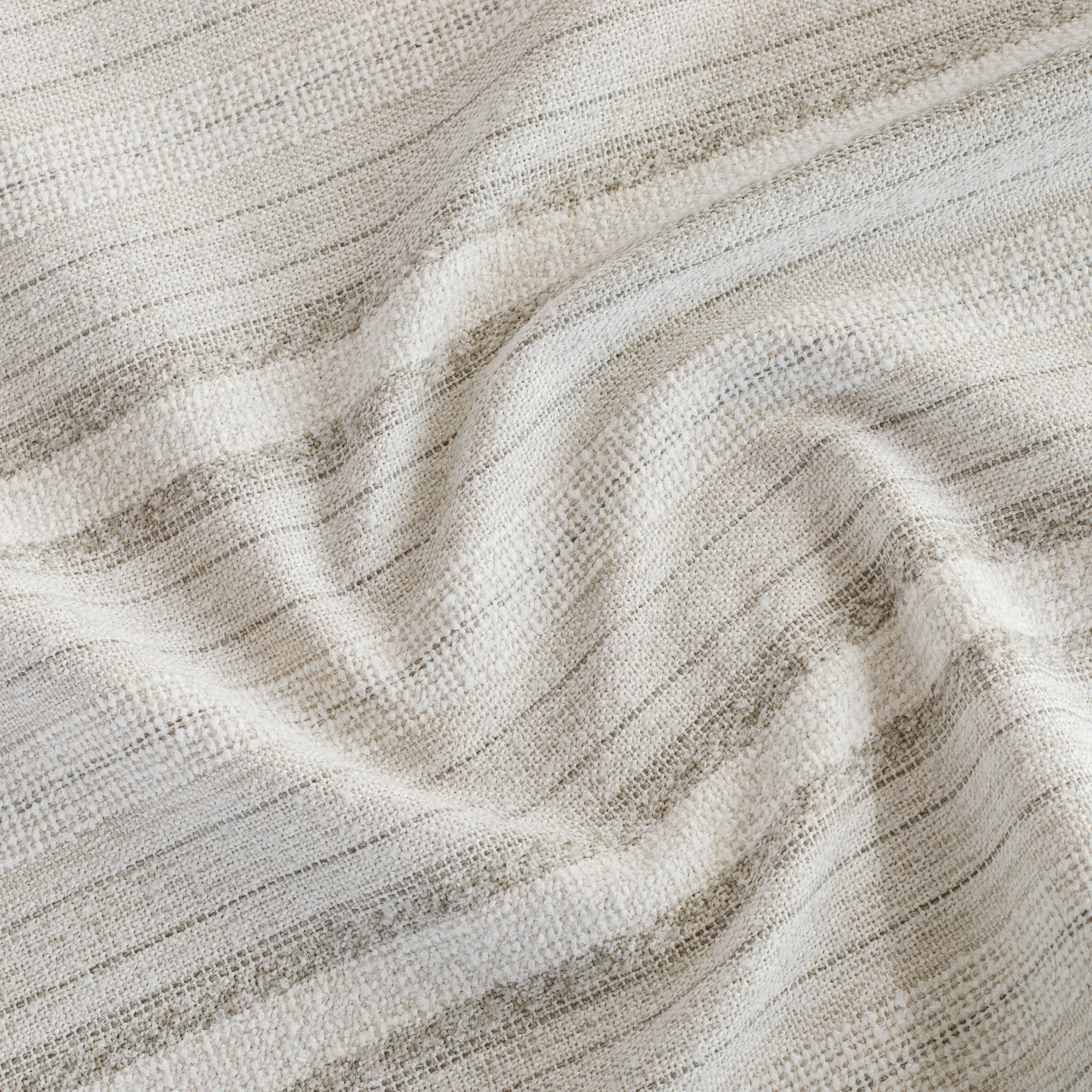 A beige, white and grey high-performance upholstery fabric from Tonic Living.