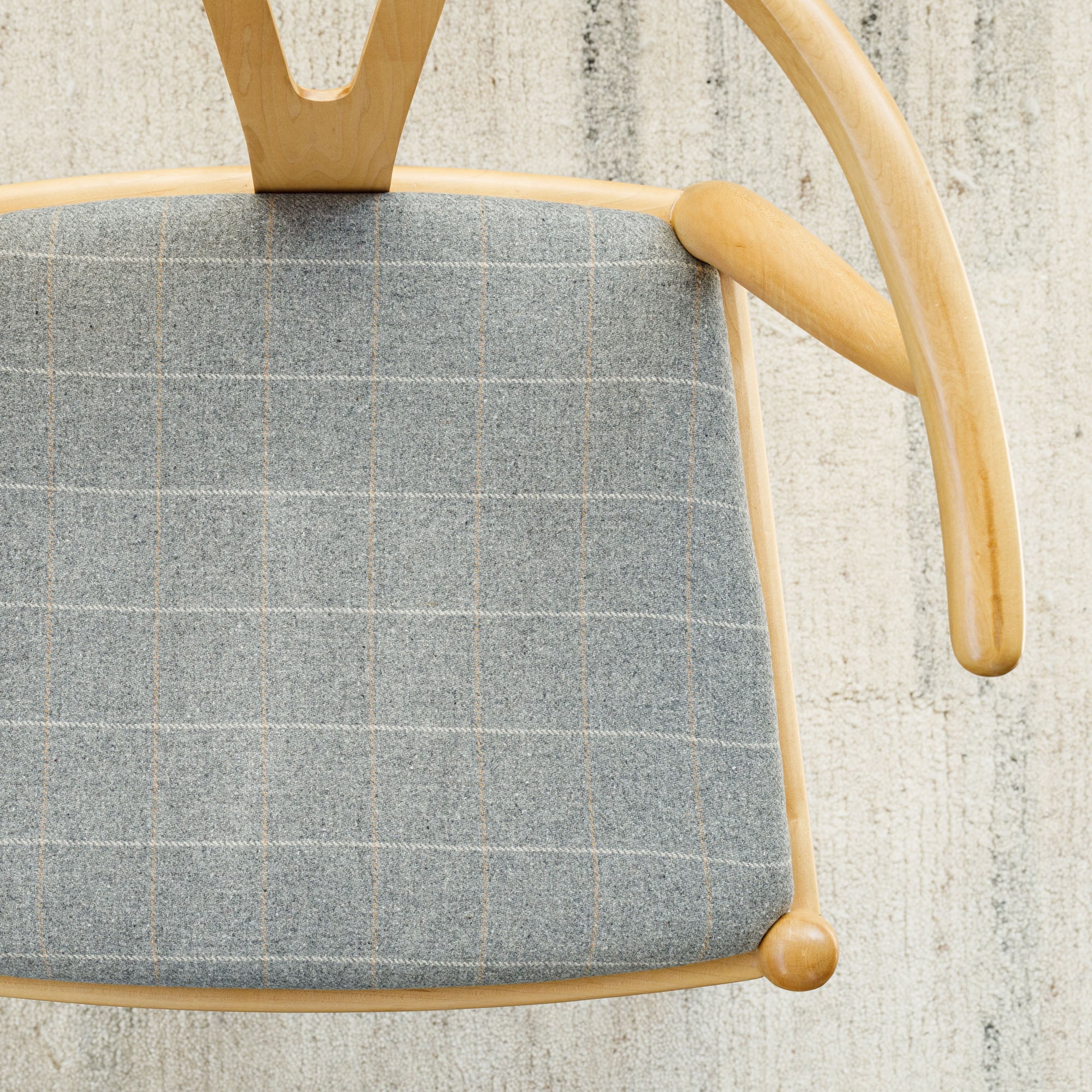 a heather grey windowpane check upholstered chair seat