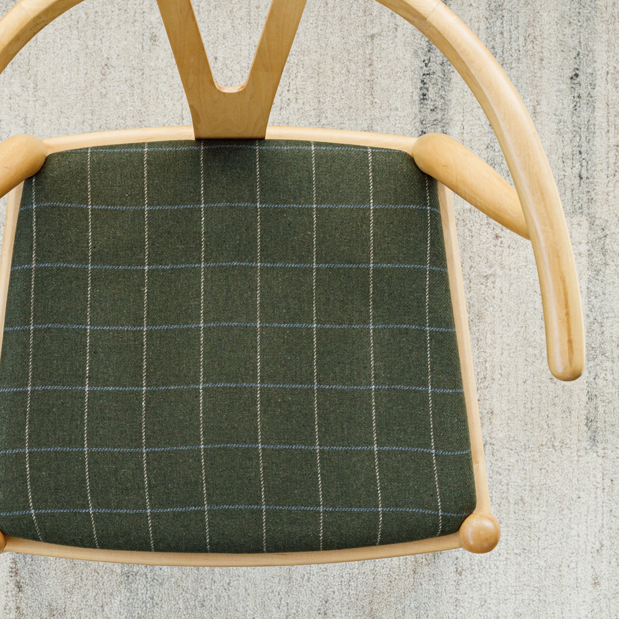 a moss green, beige and light blue windowpane check upholstered chair seat