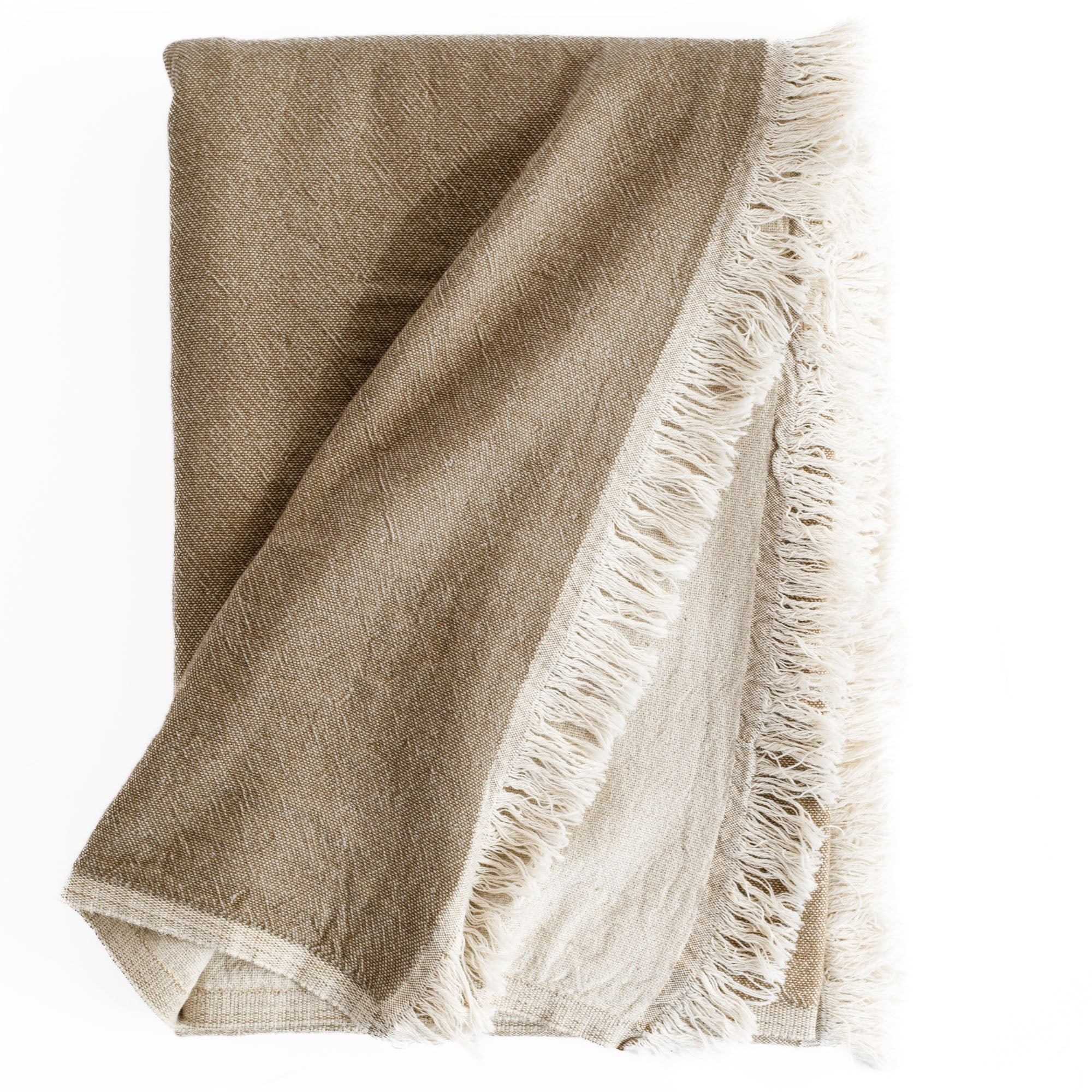 Alba Throw Blanket Bark, a reversible light brown and natural linen cotton throw blanket with a delicate fringe edge from Tonic Living