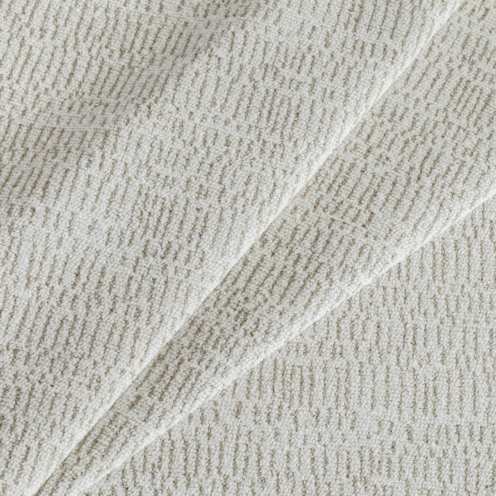 Avani Sand Fabric, a cream and beige high-performance upholstery fabric from Tonic Living.