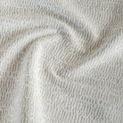 A cream and beige high-performance upholstery fabric from Tonic Living.