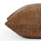 an earthy brown chenille throw pillow: close up side view