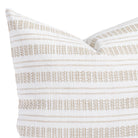 a white and tan striped throw pillow - close up view