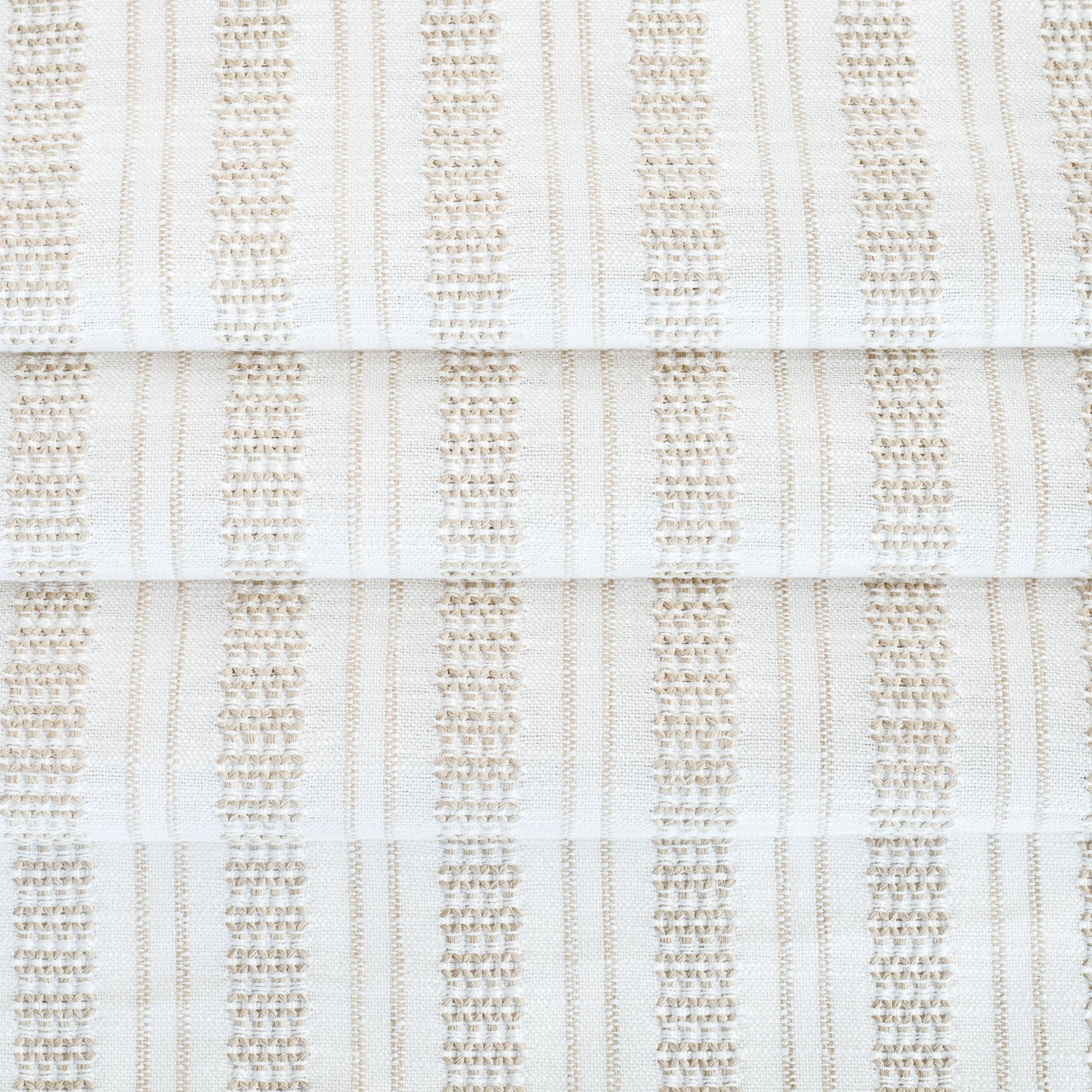 a white and beige woven stripe patterned home decor fabric