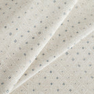 Brighton Ice Blue Fabric, a pearly beige and ice blue diamond patterned chenille upholstery from Tonic Living