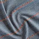 a navy blue home decor fabric with a chunky rust red stripe 