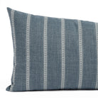 A blue and white striped lumbar pillow: close up view.