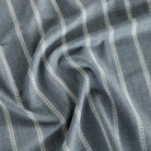 a chambray blue and white striped home decor fabric