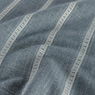 a chambray blue and white striped fabric: close up view