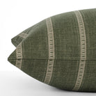 A green and white striped large pillow: close up side view.