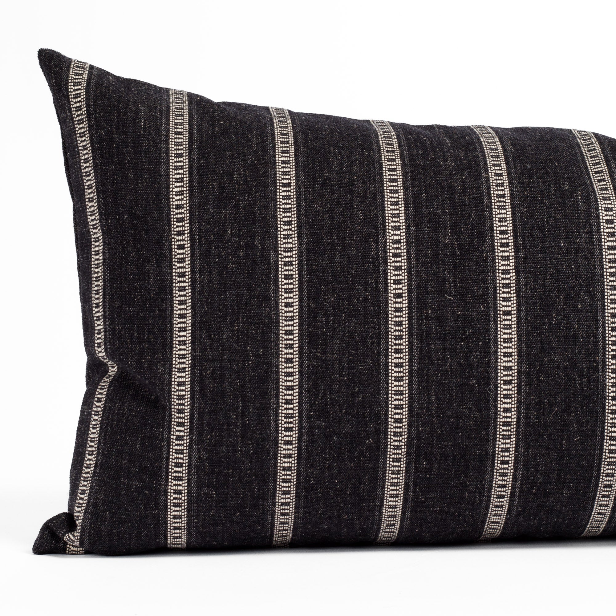 A black and white striped large lumbar pillow: close up view.