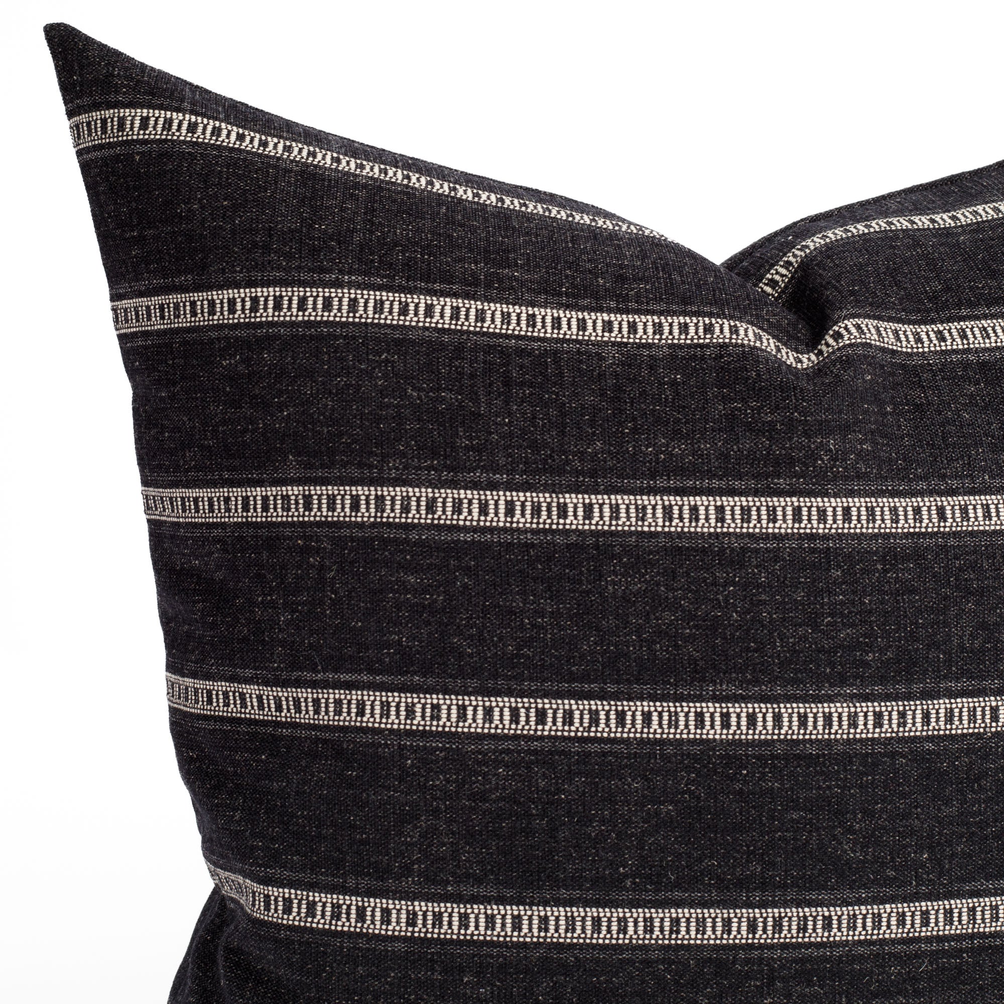 A black and white striped throw pillow: close up view.