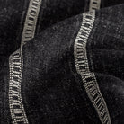 a faded black and soft white stripe fabric: close up view