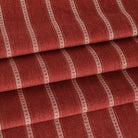 a deep red and white stripe upholstery fabric 