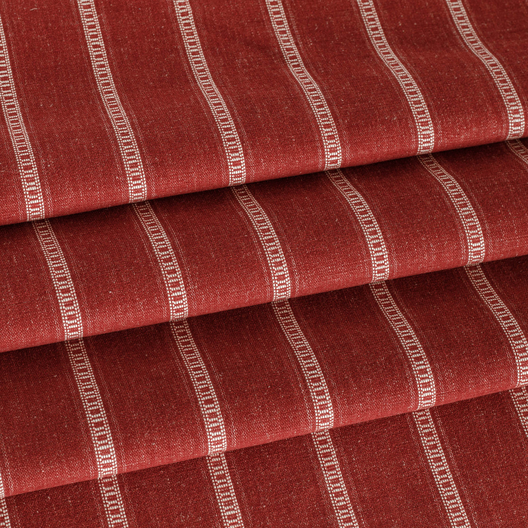 a deep red and white stripe upholstery fabric 