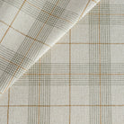 an oatmeal, caramel and green woven plaid patterned upholstery fabric from Tonic Living