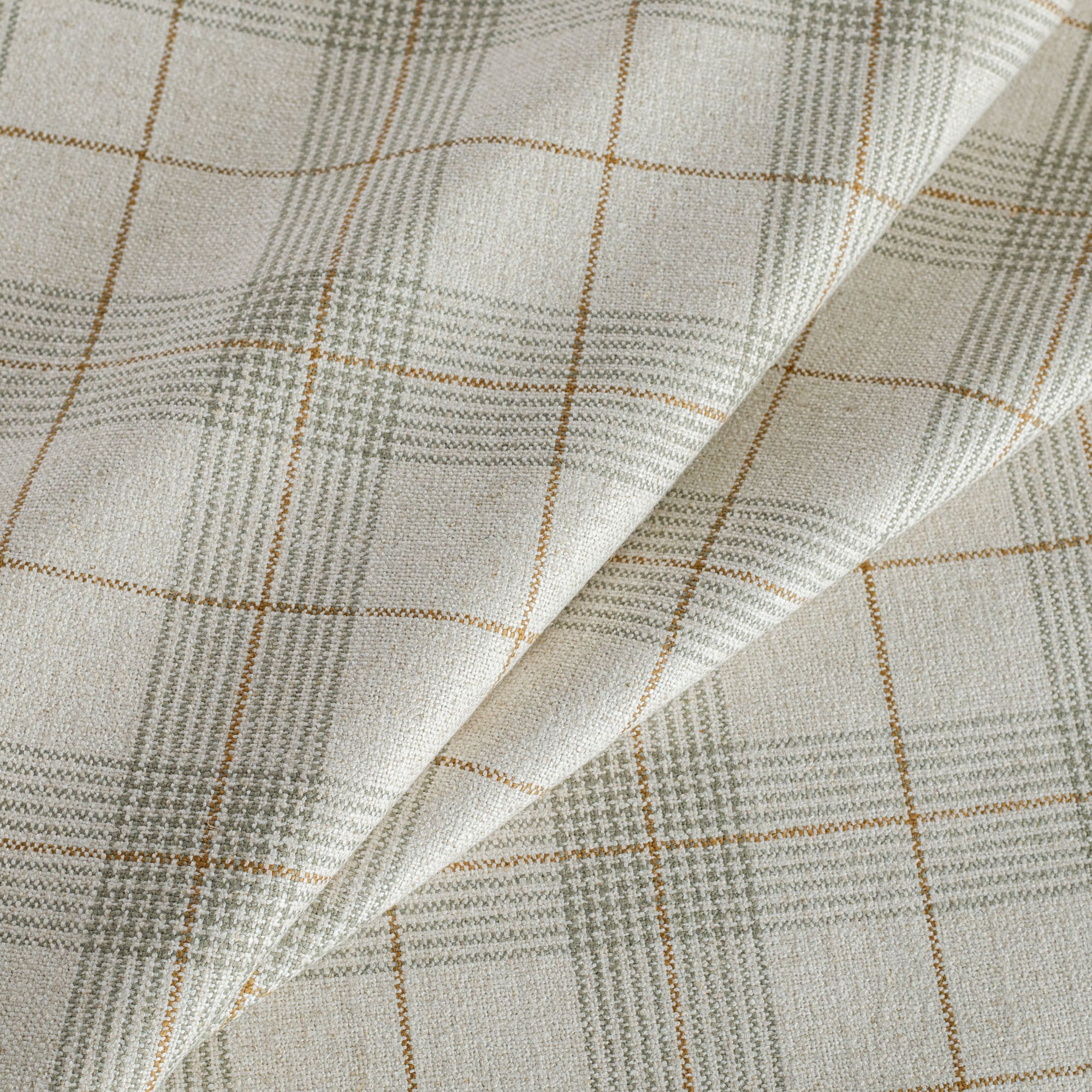 Cabot Plaid sage, an oatmeal, caramel and green woven plaid patterned upholstery fabric from Tonic Living