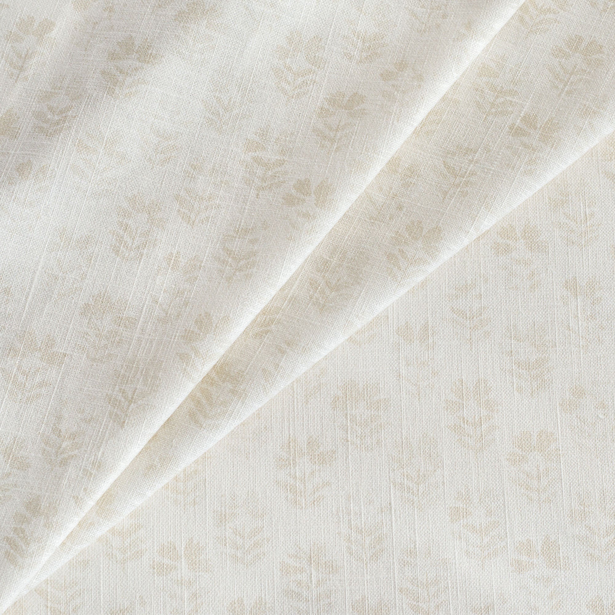 Carmel Fabric Parchment,  a neutral cream subtle block-print style floral print drapery fabric from Tonic Living