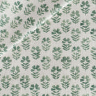 Carmel Pine, a light-weight fabric with a fresh green and cream floral block print from Tonic Living.