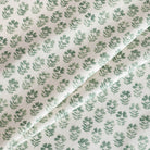 Carmel Pine Fabric, a white and green floral block-print linen-blend drapery fabric from Tonic Living.