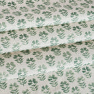 A white and green block print floral fabric from Tonic Living.