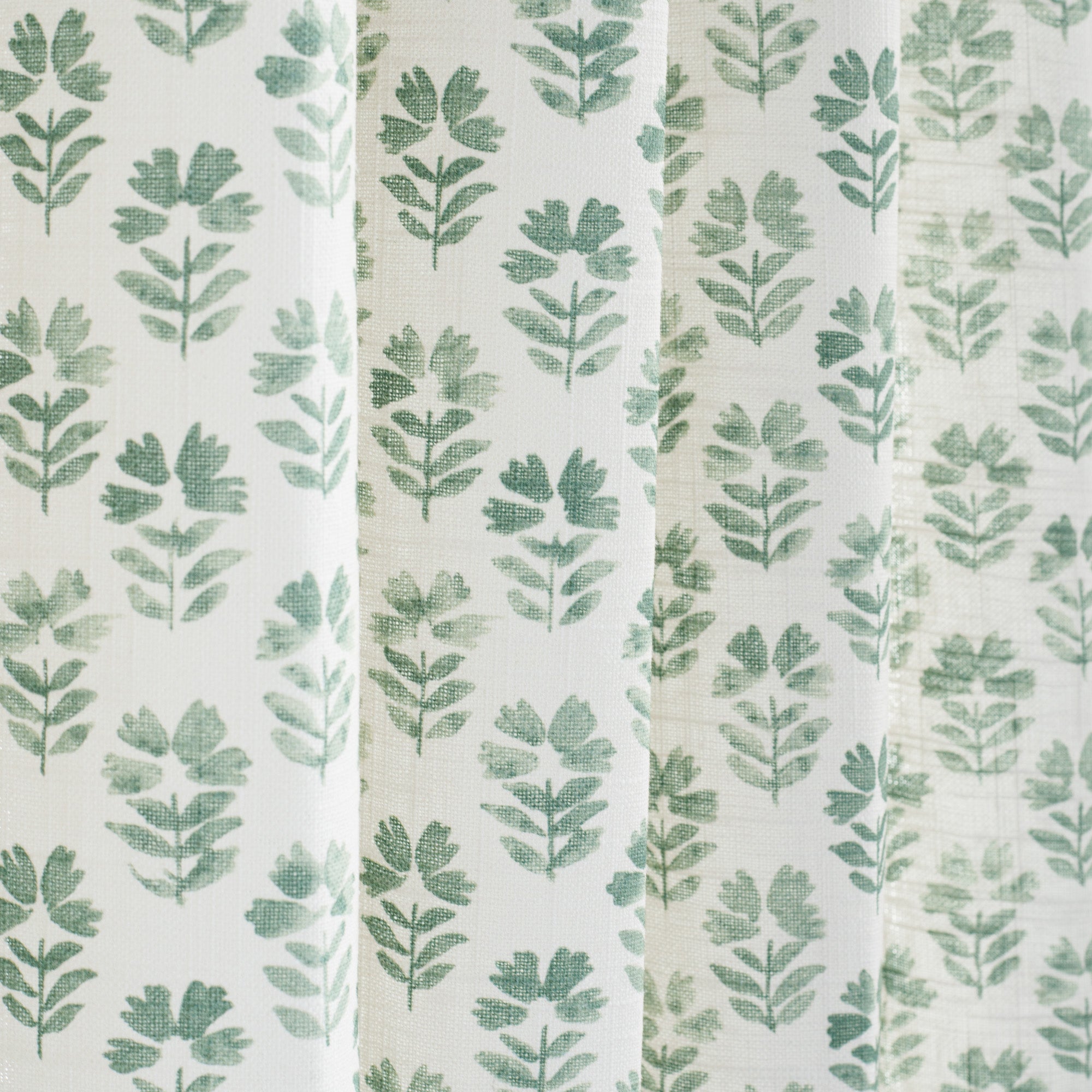 Cream and light green linen-blend curtain fabric from Tonic Living.