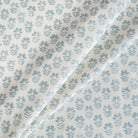 Carmel Sky Blue Fabric, a white and blue floral block-print linen-blend drapery fabric from Tonic Living.