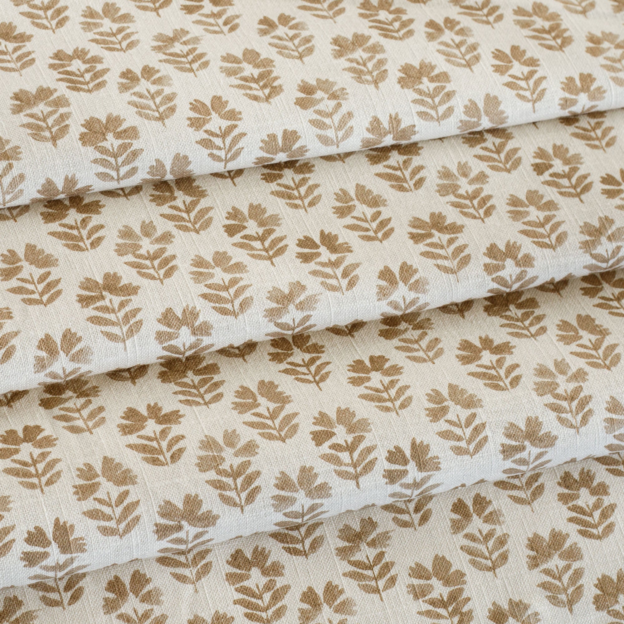 an oatmeal and brown floral block-print drapery fabric