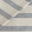 an oatmeal and denim blue loopy stripe upholstery fabric from Tonic Living