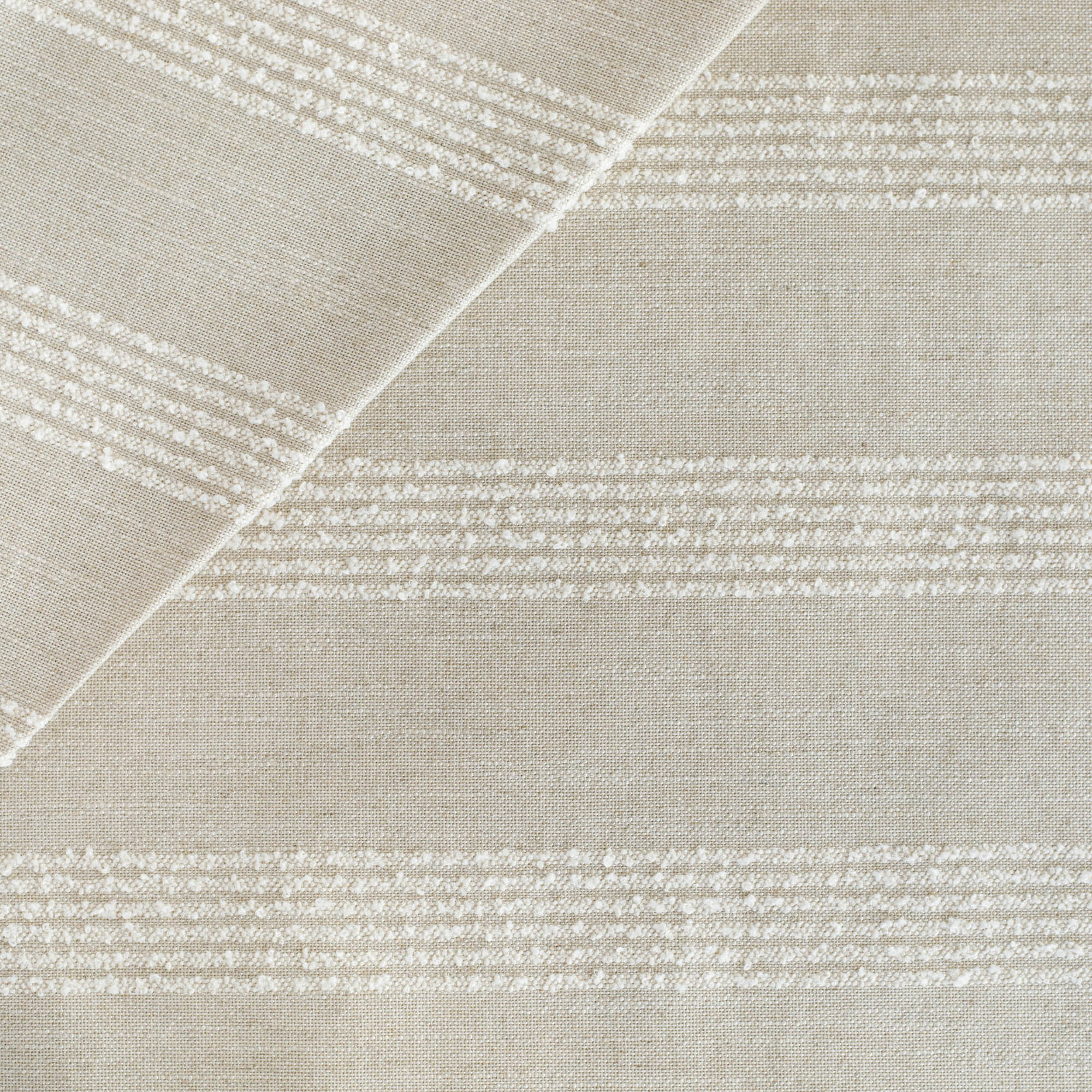 an oatmeal and off white loopy stripe upholstery fabric from Tonic Living