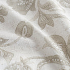 an oatmeal and earthy grey floral print multi purpose fabric : close up view