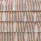 a rust red, parchment and black stripe multi use fabric