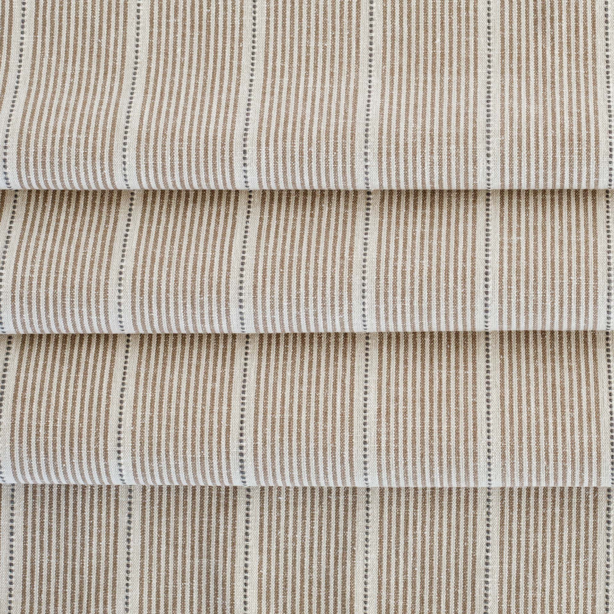 a brown, parchment and black stripe patterned multi-use fabric from Tonic Living