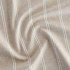 a brown, cream and black stripe patterned multi-use fabric