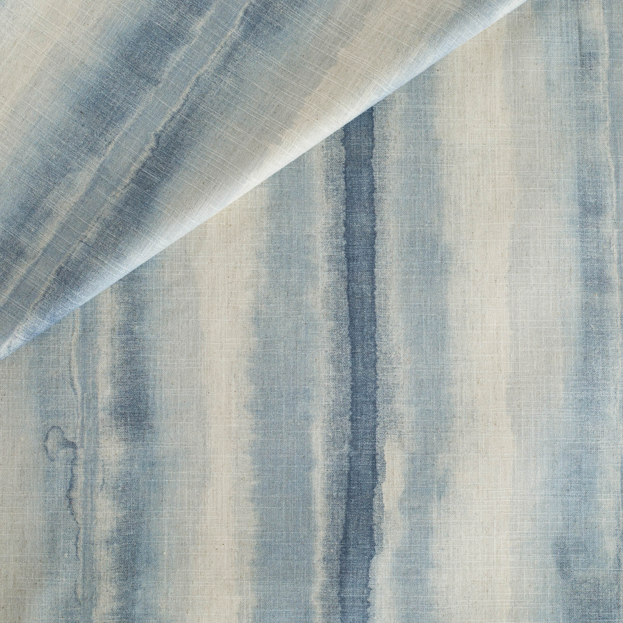 Ibiza Ocean, a painterly blue ombre stripe print drapery fabric from Tonic Living