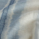 a painterly blue ombre stripe print drapery fabric : close up view