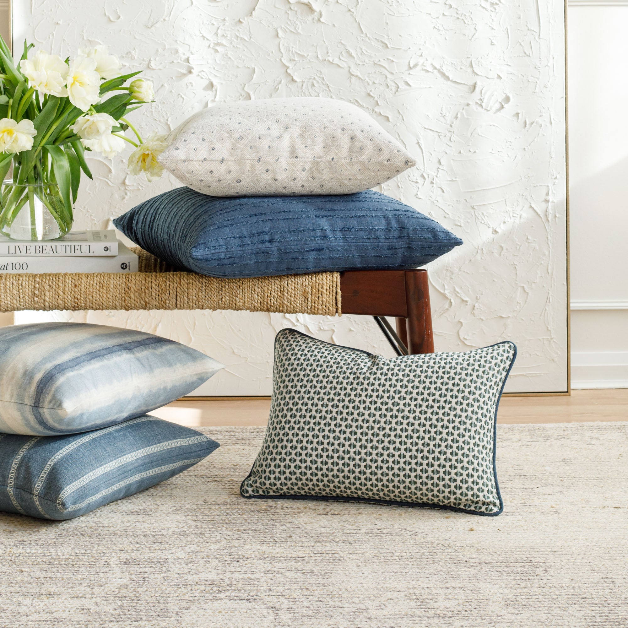 A selection of blue patterned designer pillows from Tonic Living.