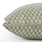 Medium green and oatmeal textured pillow: close up side view.