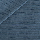 a navy blue upholstery fabric with a textured bouclé stripe from Tonic Living