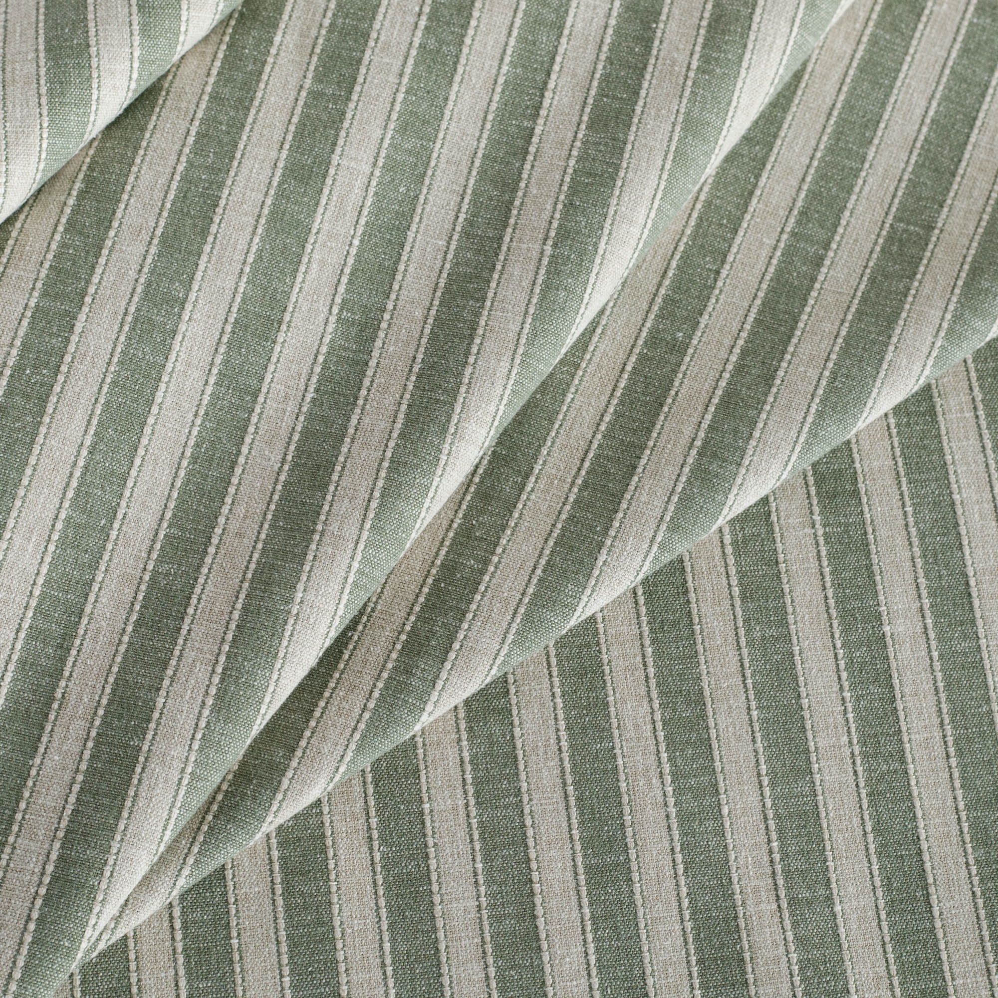 a pine green and beige Tonic Living upholstery fabrics