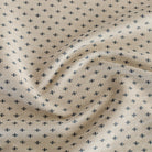 A beige and dark blue upholstery fabric from Tonic Living that has a classic preppy feel.