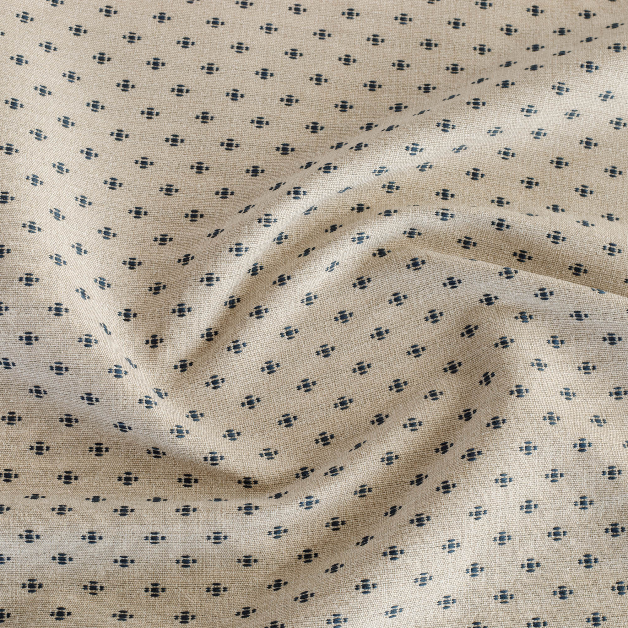 A beige and dark blue upholstery fabric from Tonic Living that has a classic preppy feel.