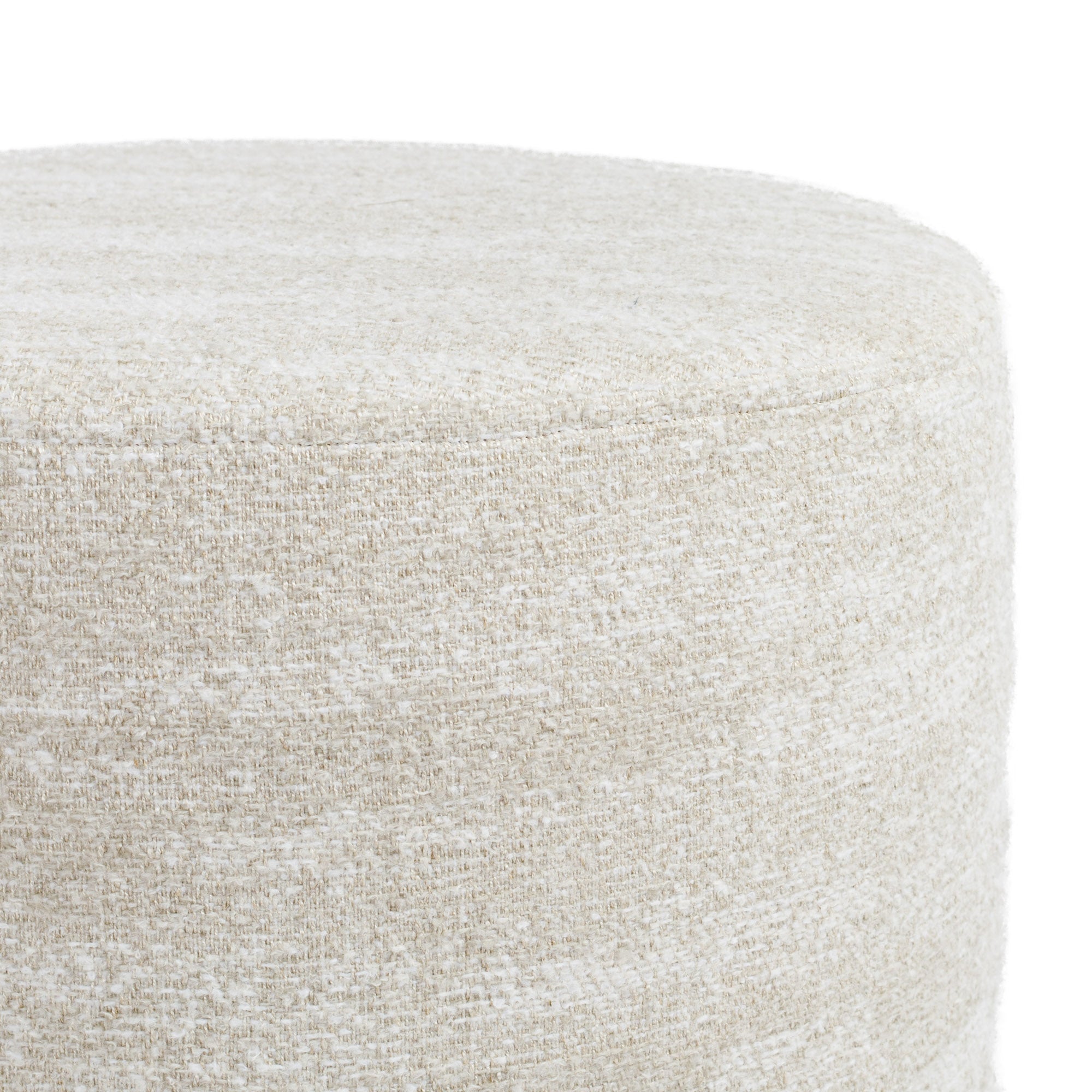 a creamy beige round ottoman - close up view