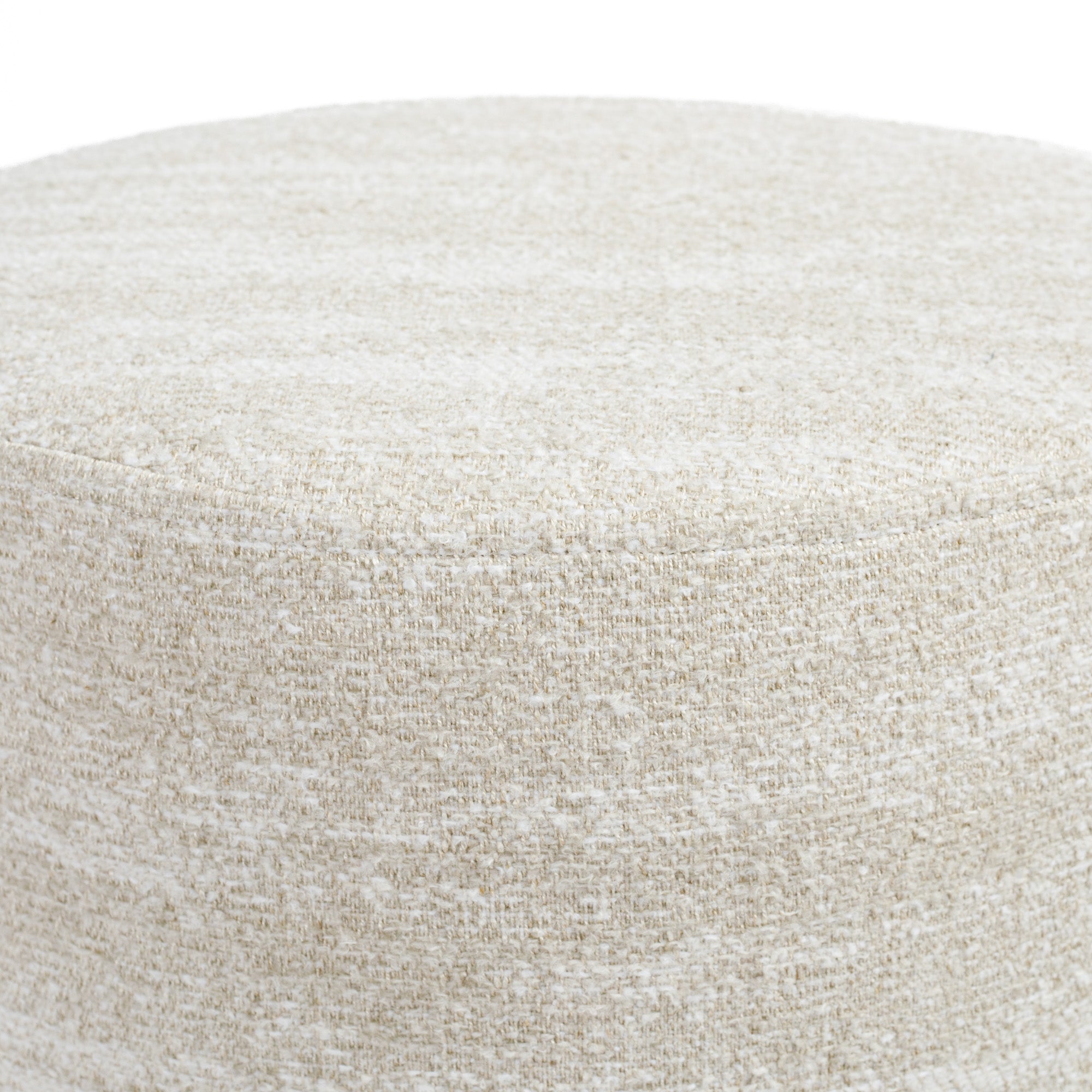 a creamy beige round ottoman - close up top view