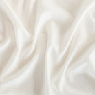 a cream coloured flowy drapery fabric