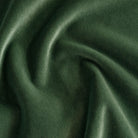 A forest green velvet fabric with a subtle glow.